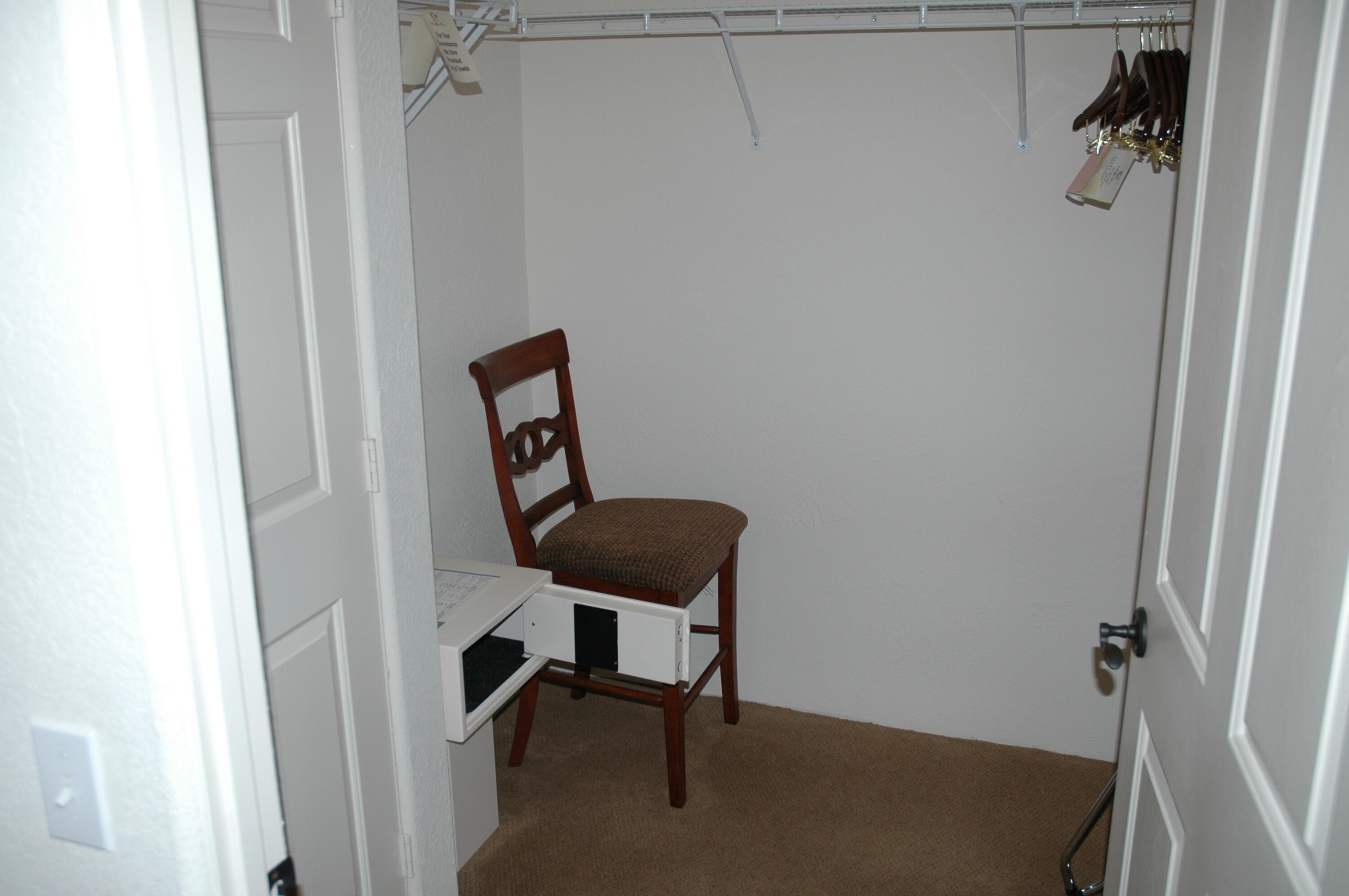 50740 Santa Rosa Plaza, Unit 5 La Quinta, CA 92253 - Photo 14 of 17 a view of a hallway with furniture and a door
