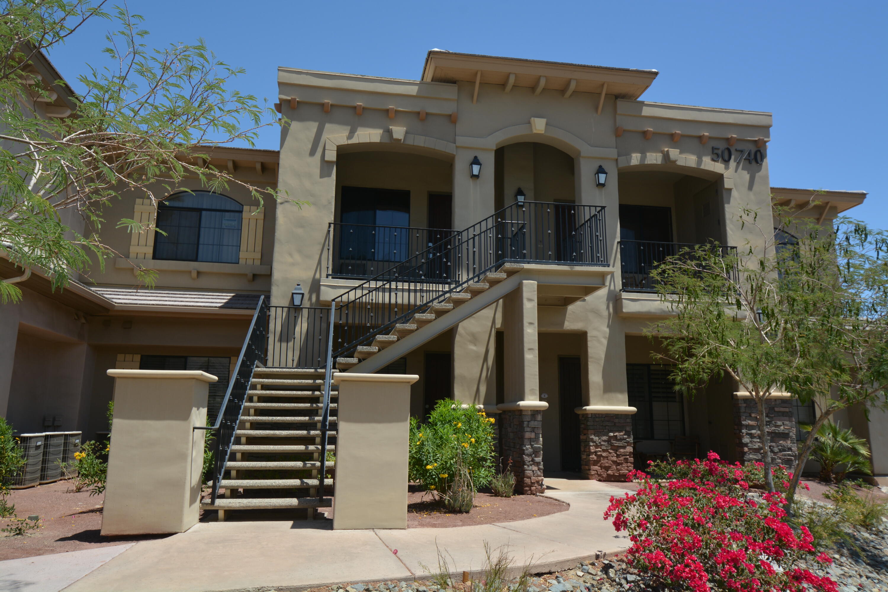 50740 Santa Rosa Plaza, Unit 5 La Quinta, CA 92253 - Photo 2 of 17 a front view of a house