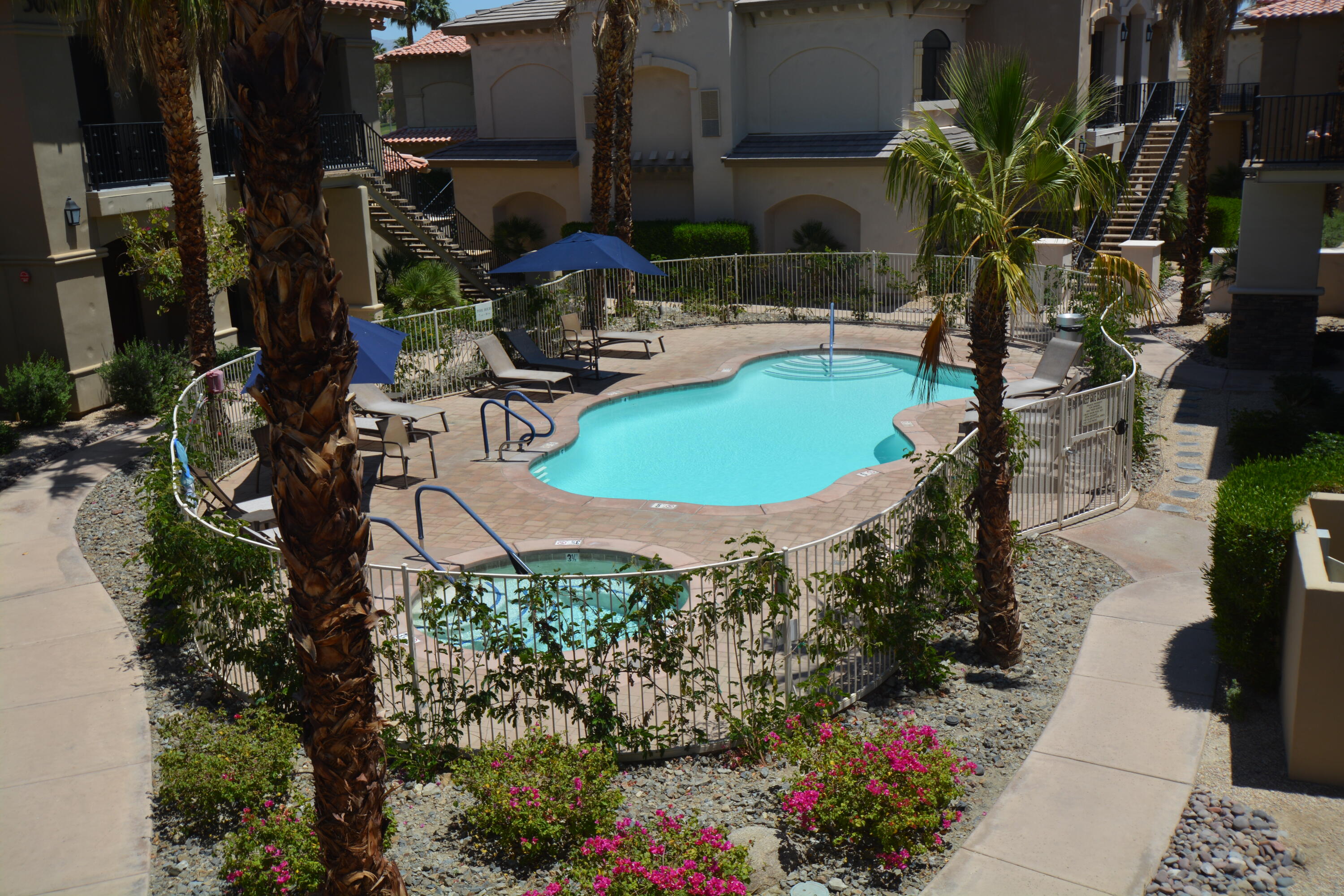 50740 Santa Rosa Plaza, Unit 5 La Quinta, CA 92253 - Photo 5 of 17 an aerial view of a house with a swimming pool
