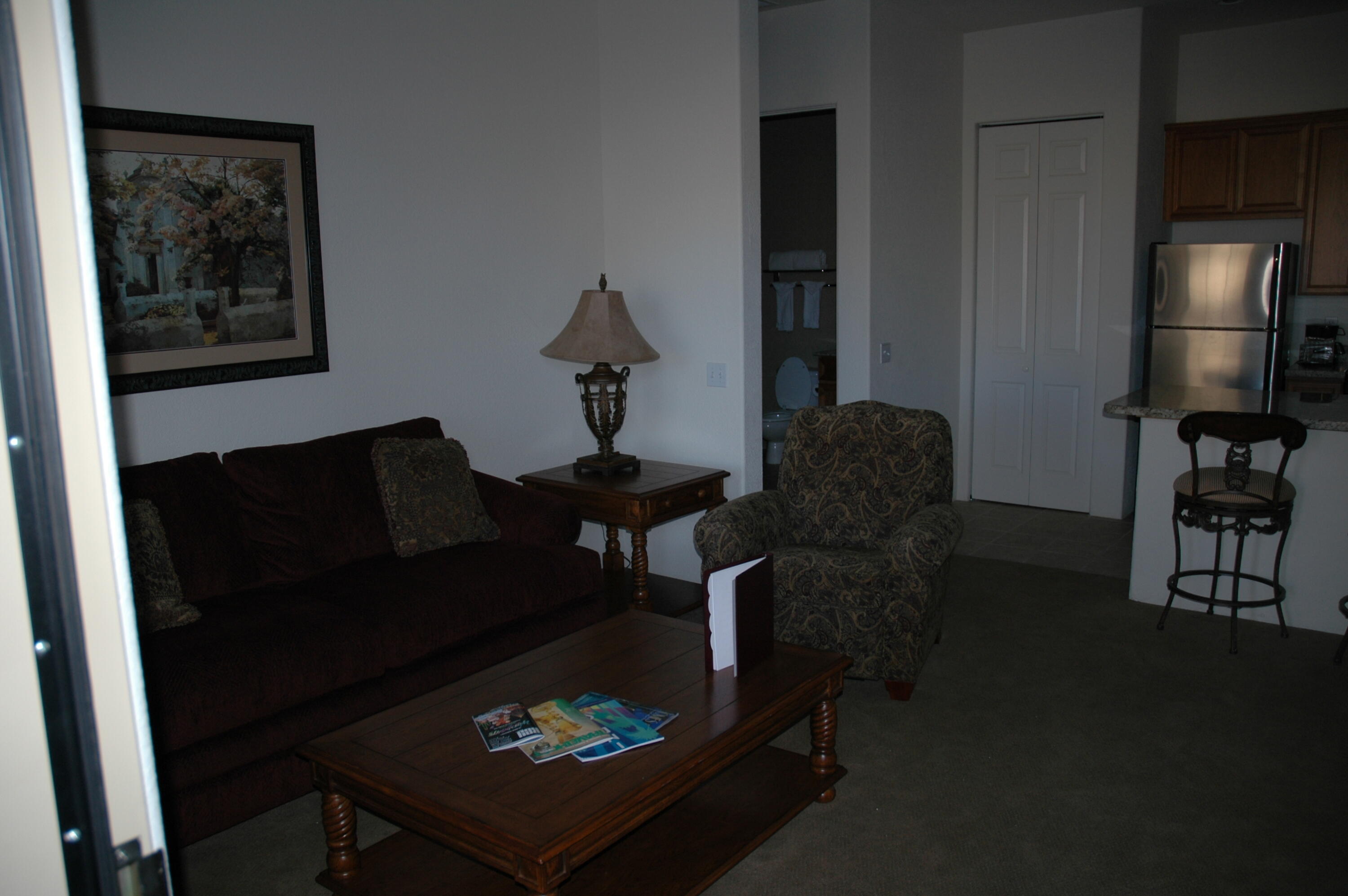 50740 Santa Rosa Plaza, Unit 5 La Quinta, CA 92253 - Photo 6 of 17 a living room with furniture and a lamp