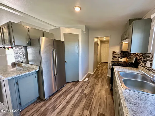 a view of a livingroom with wooden floor