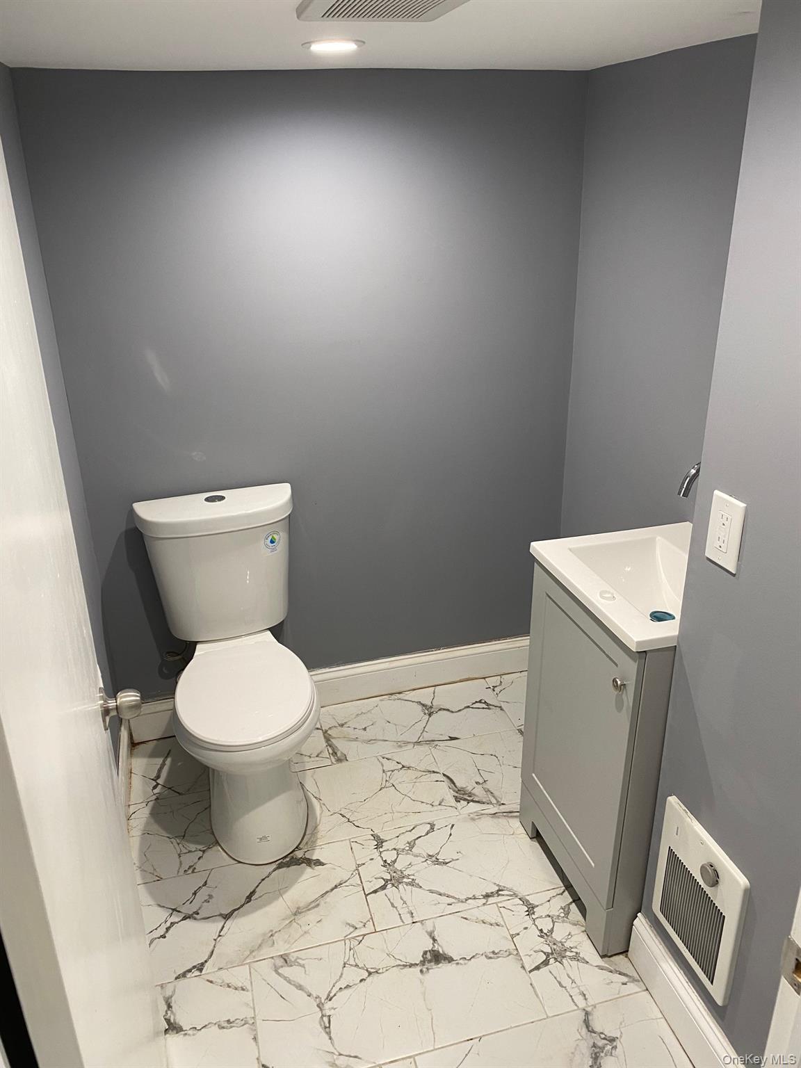 Undisclosed Address Mount Vernon, NY 10553 - Photo 16 of 20 a white toilet sitting next to a sink