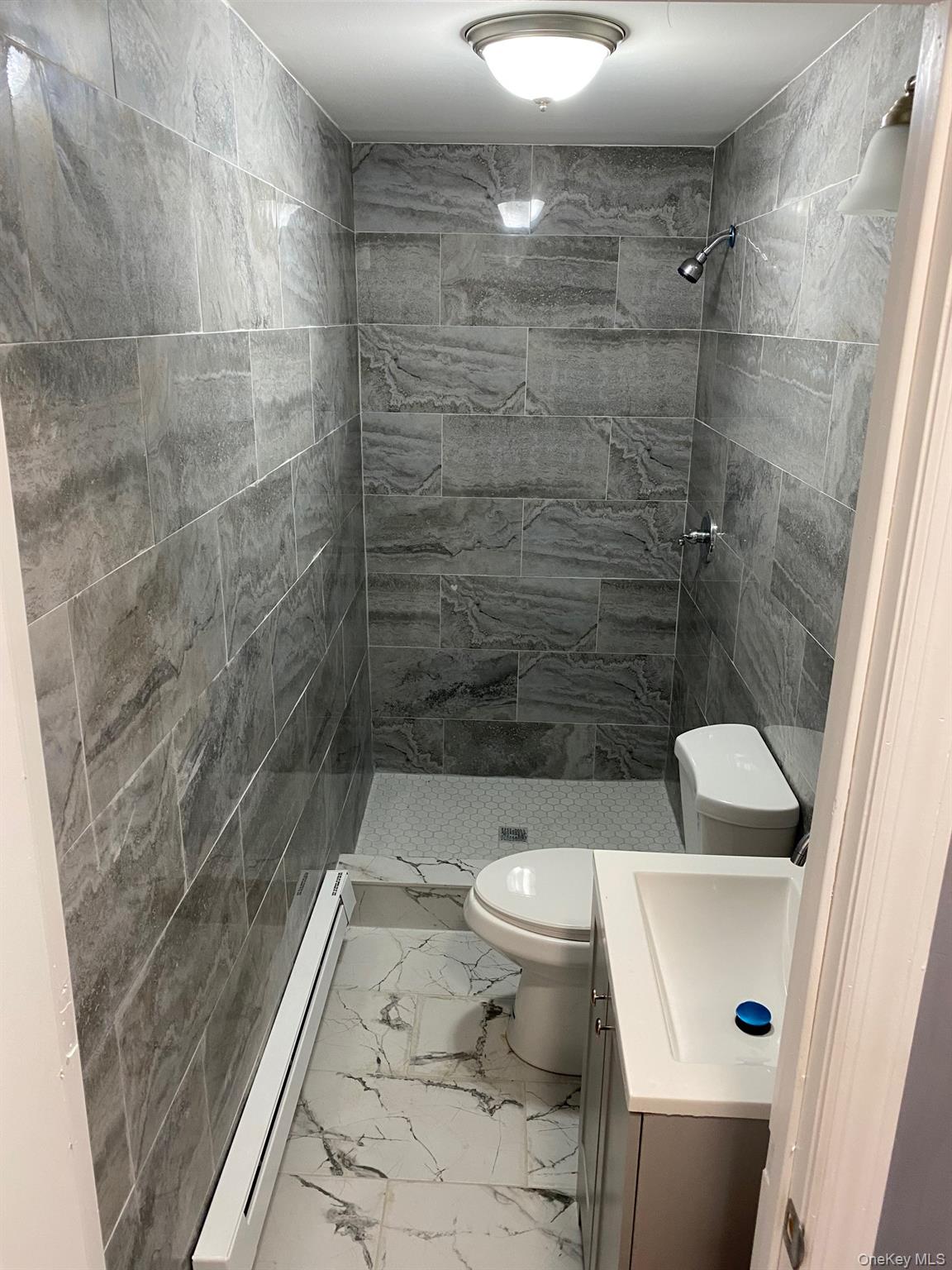 Undisclosed Address Mount Vernon, NY 10553 - Photo 8 of 20 a bathroom with a toilet and a shower