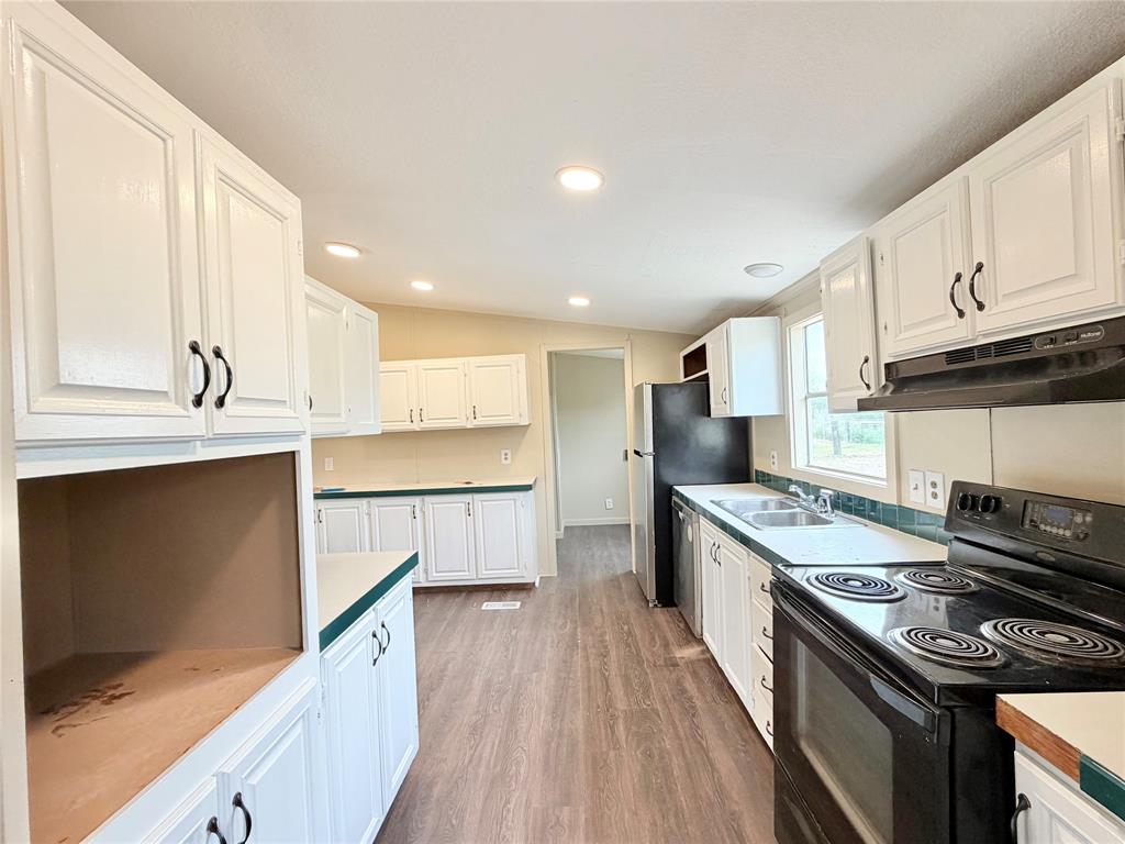 9721 Limestone Joshua, TX 76058 - Photo 17 of 36 a kitchen with stainless steel appliances granite countertop a stove a sink and a refrigerator