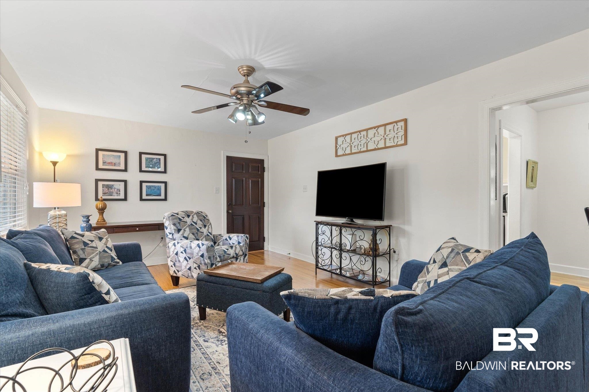 214 Upham Street, Unit 18A Mobile, AL 36607 - Photo 3 of 29 Living room with light wood-style flooring and ceiling fan