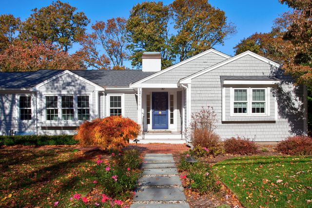 a front view of a house with garden