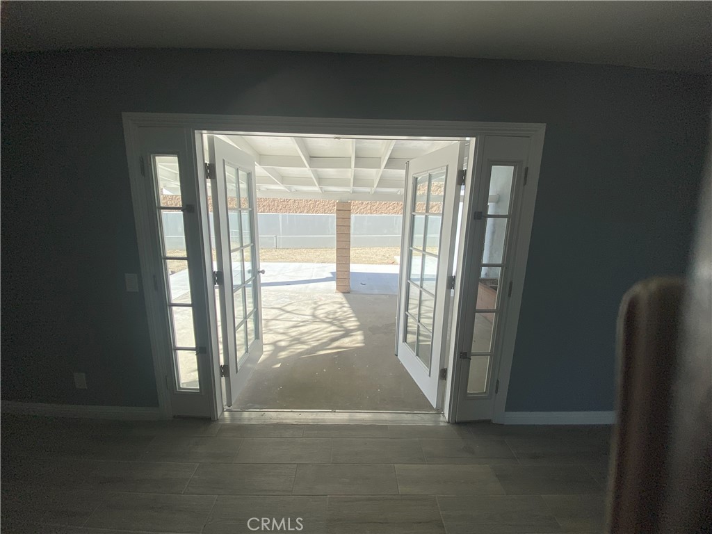 9211 Vernon Avenue Montclair, CA 91763 - Photo 5 of 16 a view of an empty room and a window