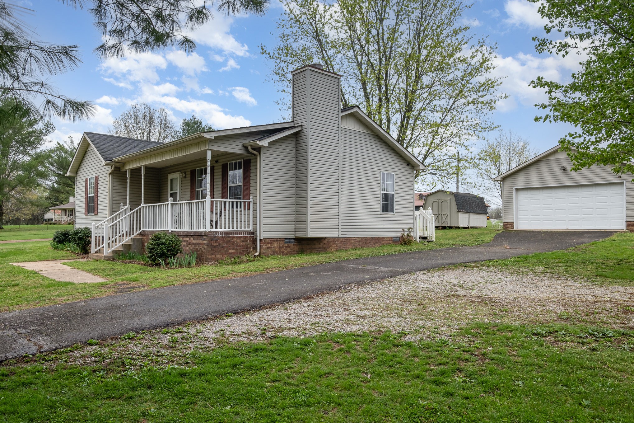 3134 Greens Mill Road Spring Hill, TN 37174 - Photo 3 of 20 a view of a yard with a house and a large tree