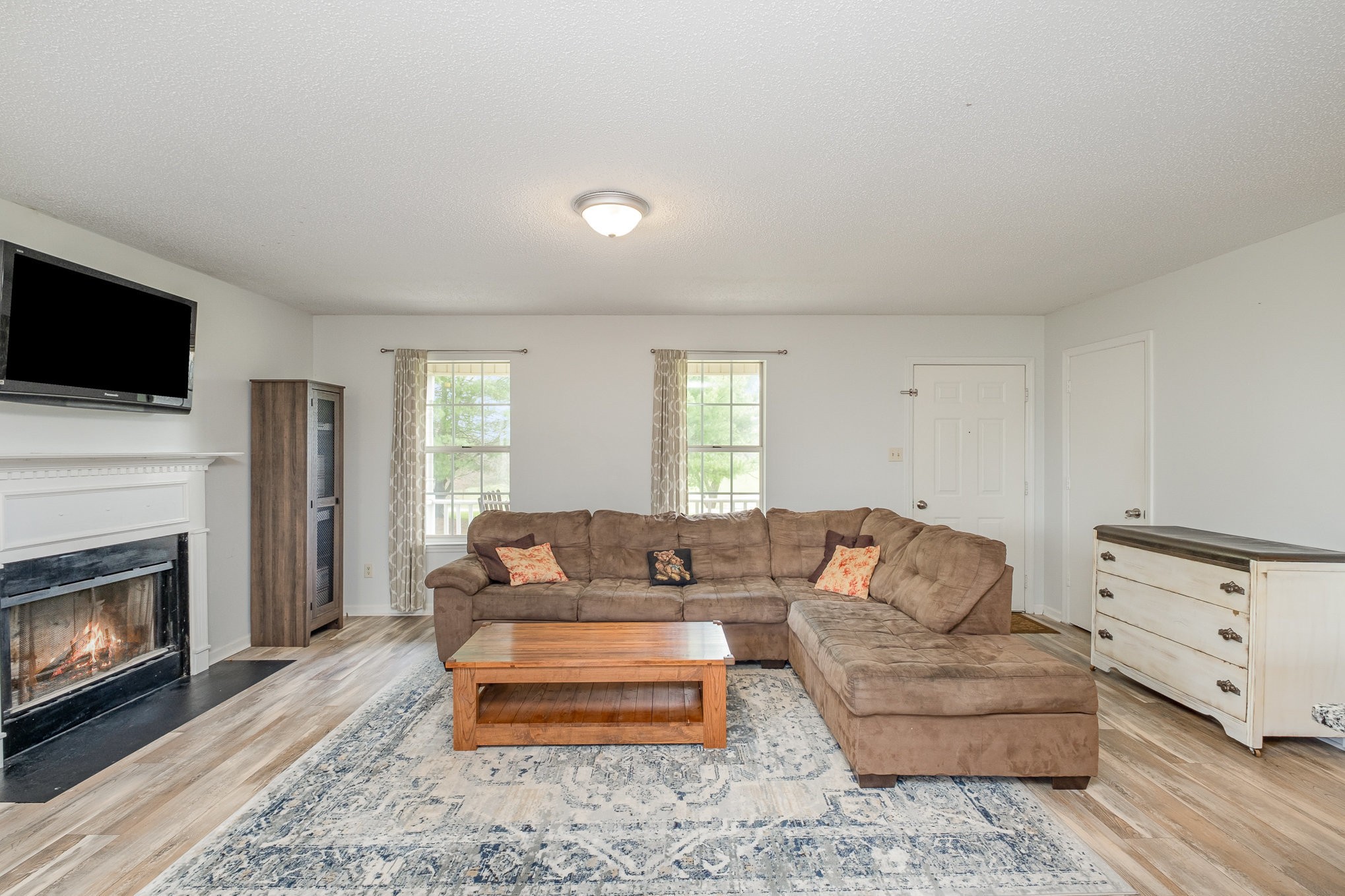 3134 Greens Mill Road Spring Hill, TN 37174 - Photo 5 of 20 a living room with furniture fireplace and flat screen tv