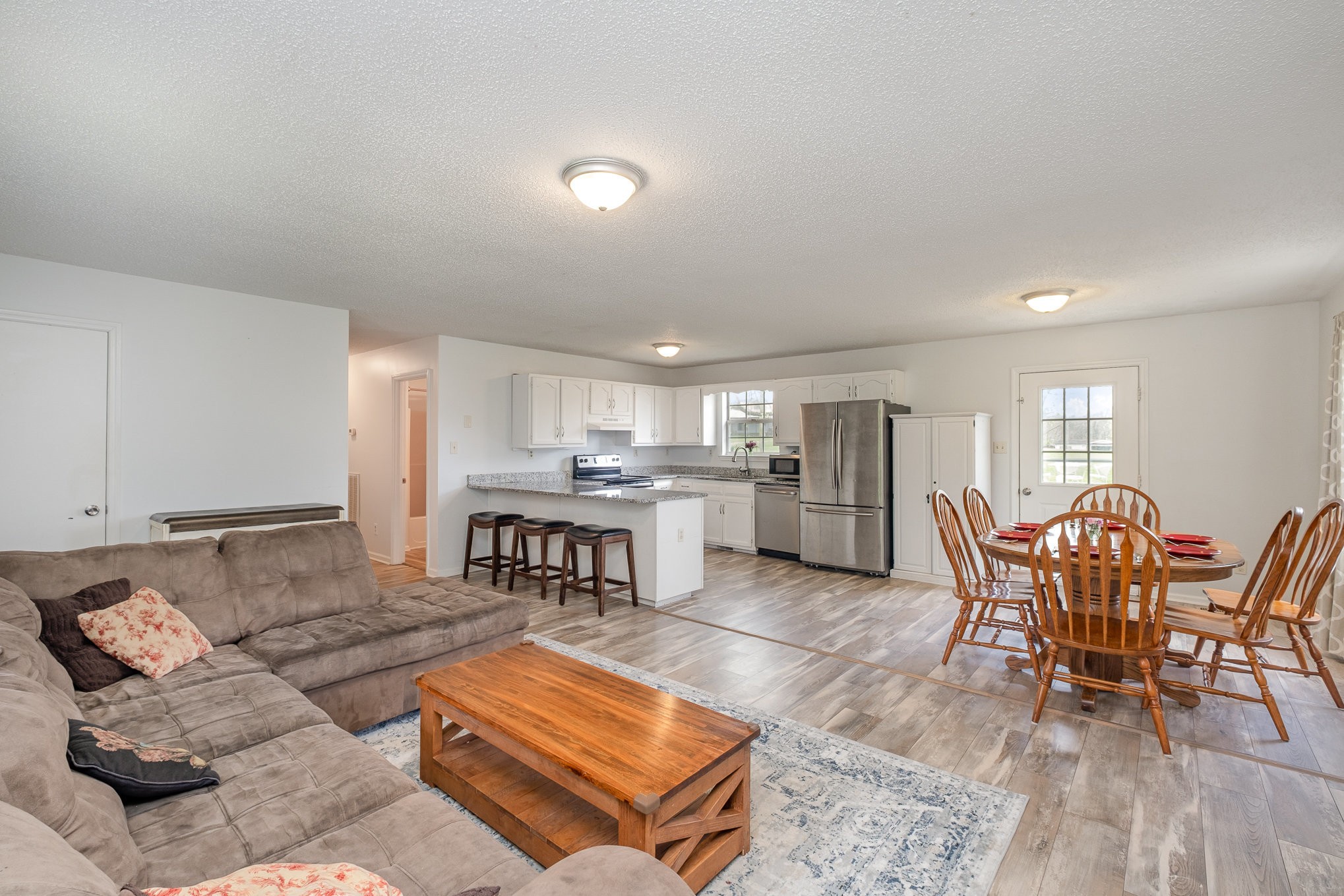 3134 Greens Mill Road Spring Hill, TN 37174 - Photo 8 of 20 a living room with furniture and kitchen view