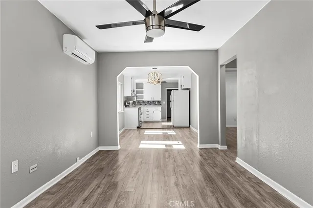 a view of a hallway view with wooden floor and staircase