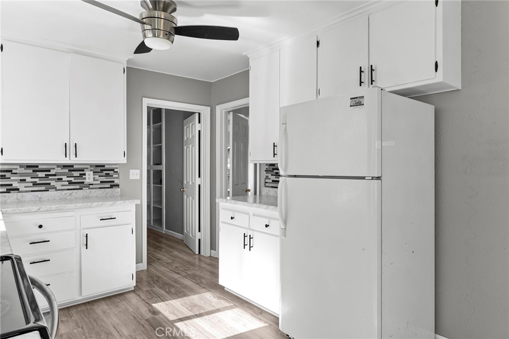 224 South Jackson Street Red Bluff, CA 96080 - Photo 17 of 44 a kitchen with stainless steel appliances a refrigerator and cabinets