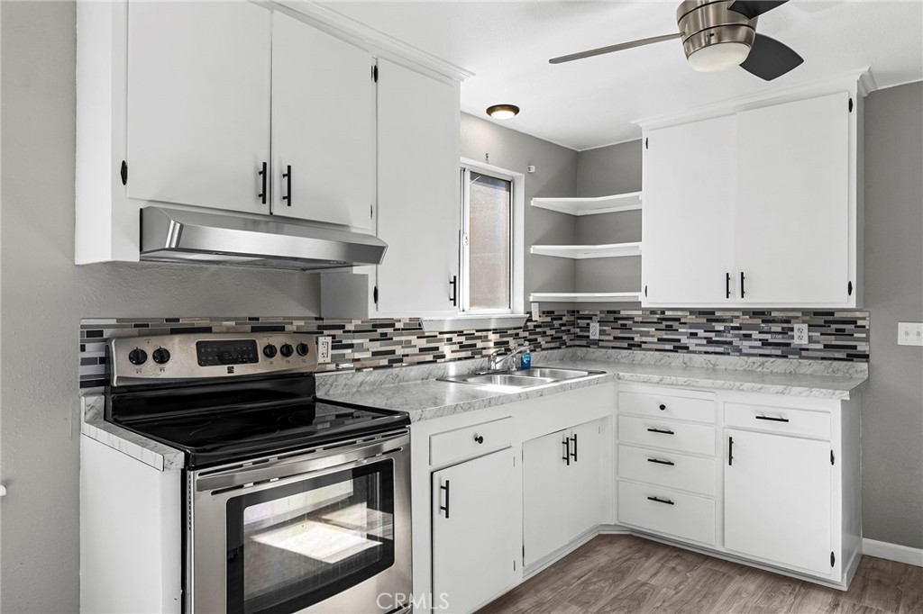 224 South Jackson Street Red Bluff, CA 96080 - Photo 2 of 44 a kitchen with white cabinets and appliances