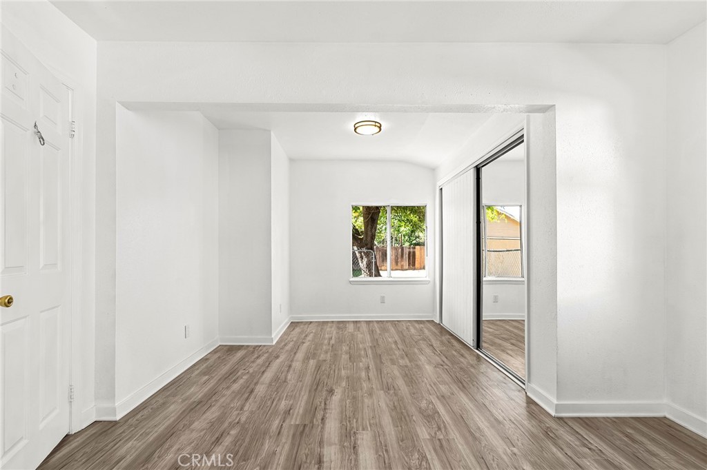 224 South Jackson Street Red Bluff, CA 96080 - Photo 21 of 44 a view of an empty room with wooden floor and a window