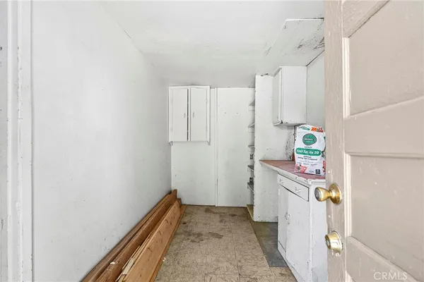 a hallway with sliding door and wooden floor