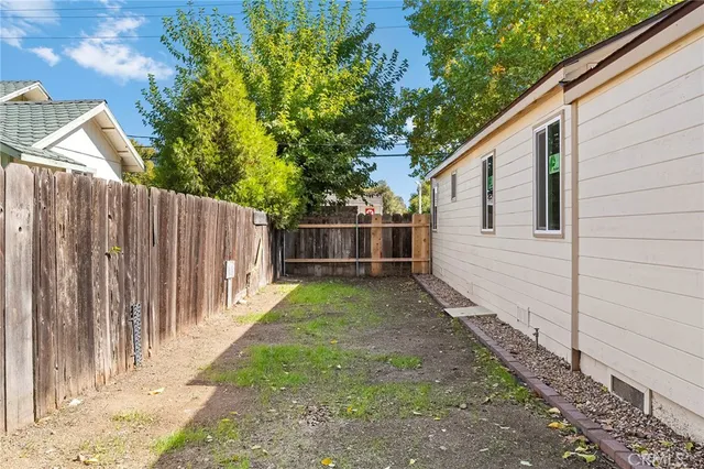 a backyard of a house with lots of green space