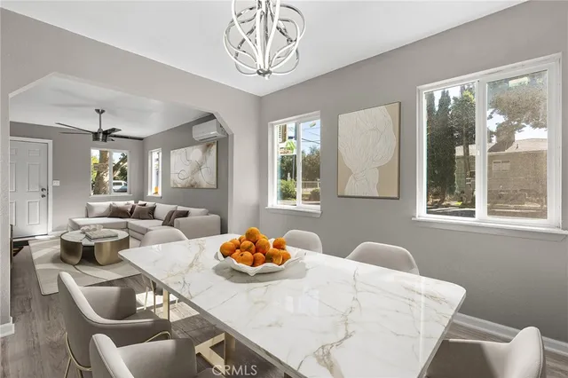 a view of a dining room and livingroom with furniture