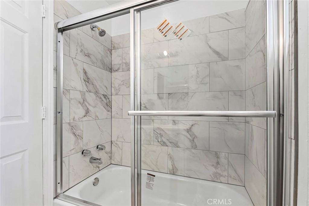 224 South Jackson Street Red Bluff, CA 96080 - Photo 7 of 44 a bathroom with a shower and a glass door
