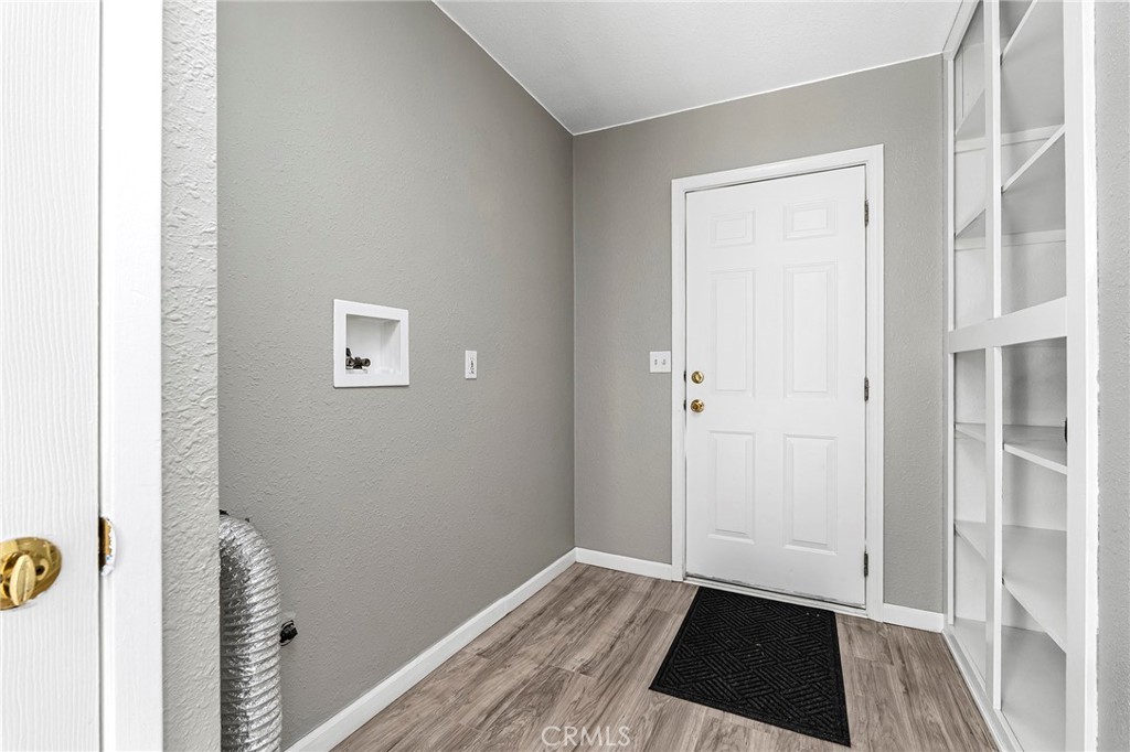 224 South Jackson Street Red Bluff, CA 96080 - Photo 9 of 44 a view of a closet area with hardwood floor
