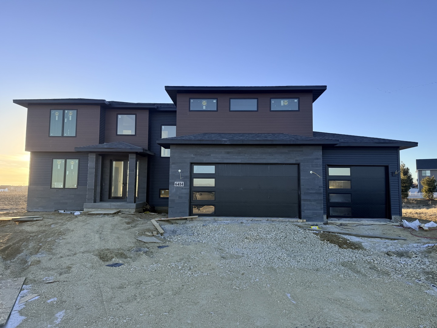6414 Pelican Street Bettendorf, IA 52722 - Photo 1 of 57 a view of a house with many windows