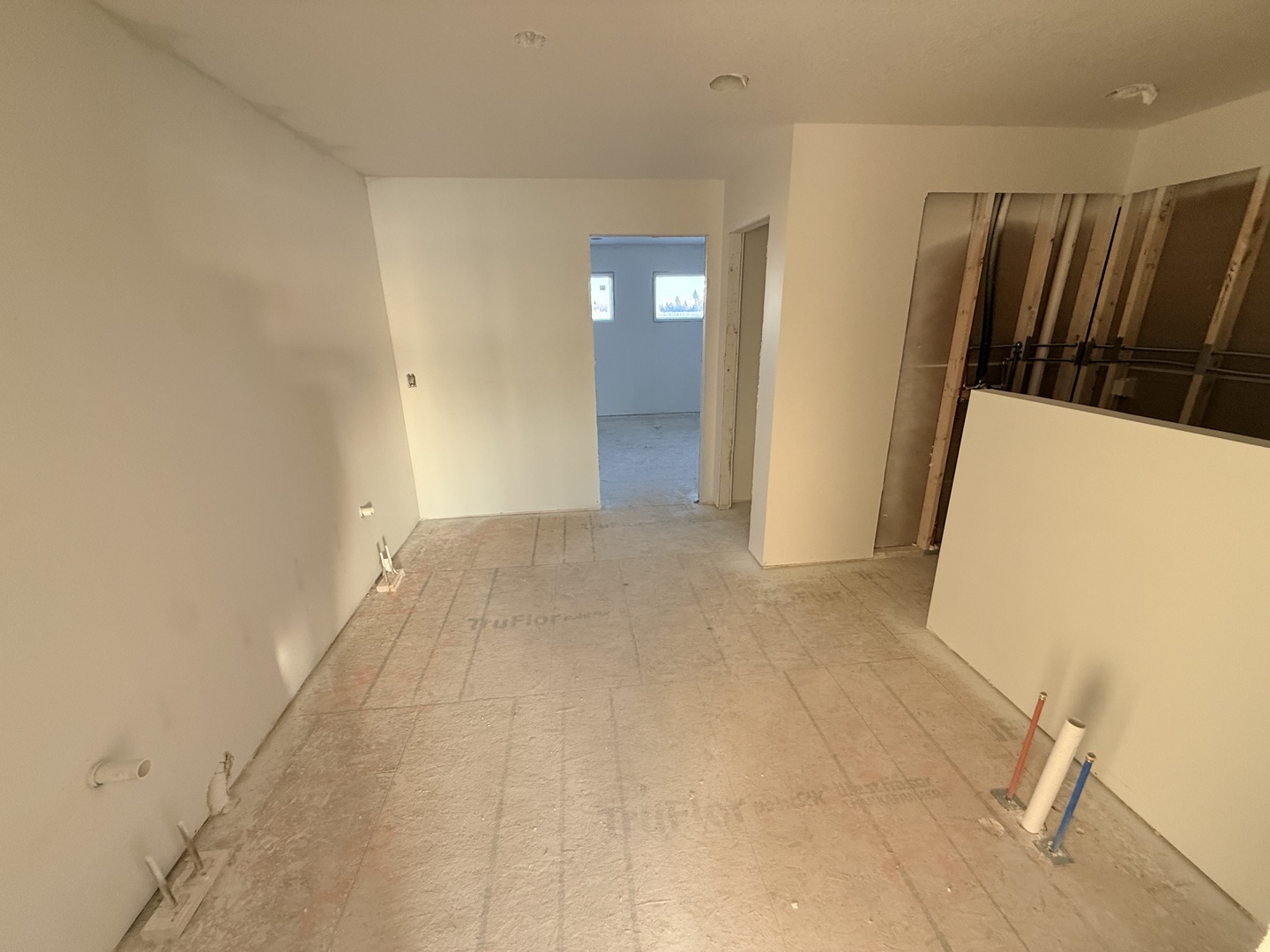6414 Pelican Street Bettendorf, IA 52722 - Photo 13 of 57 a view of hallway with stairs and wooden floor