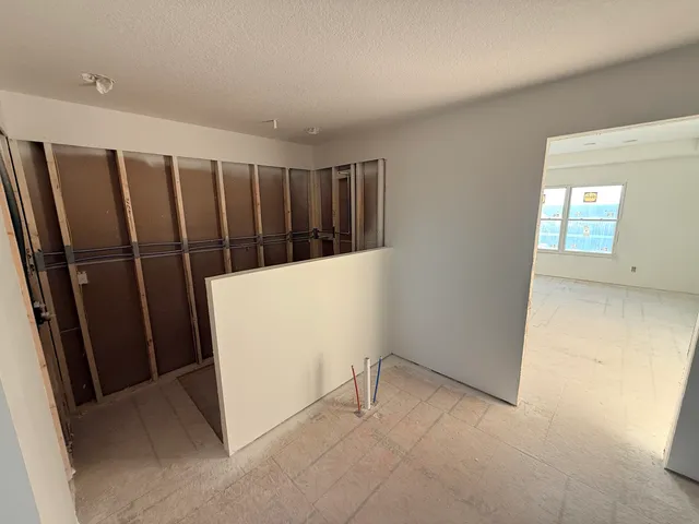 a view of wooden floor in an empty room
