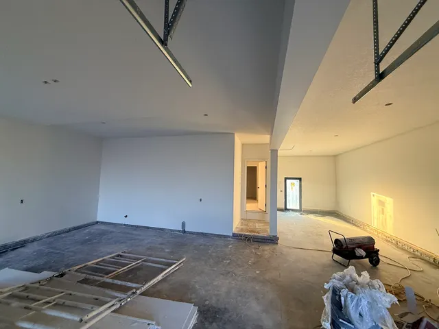 a view of entryway and hall with a front door