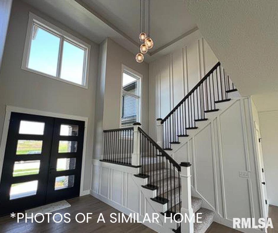 6414 Pelican Street Bettendorf, IA 52722 - Photo 24 of 57 a view of entryway and hall with a front door