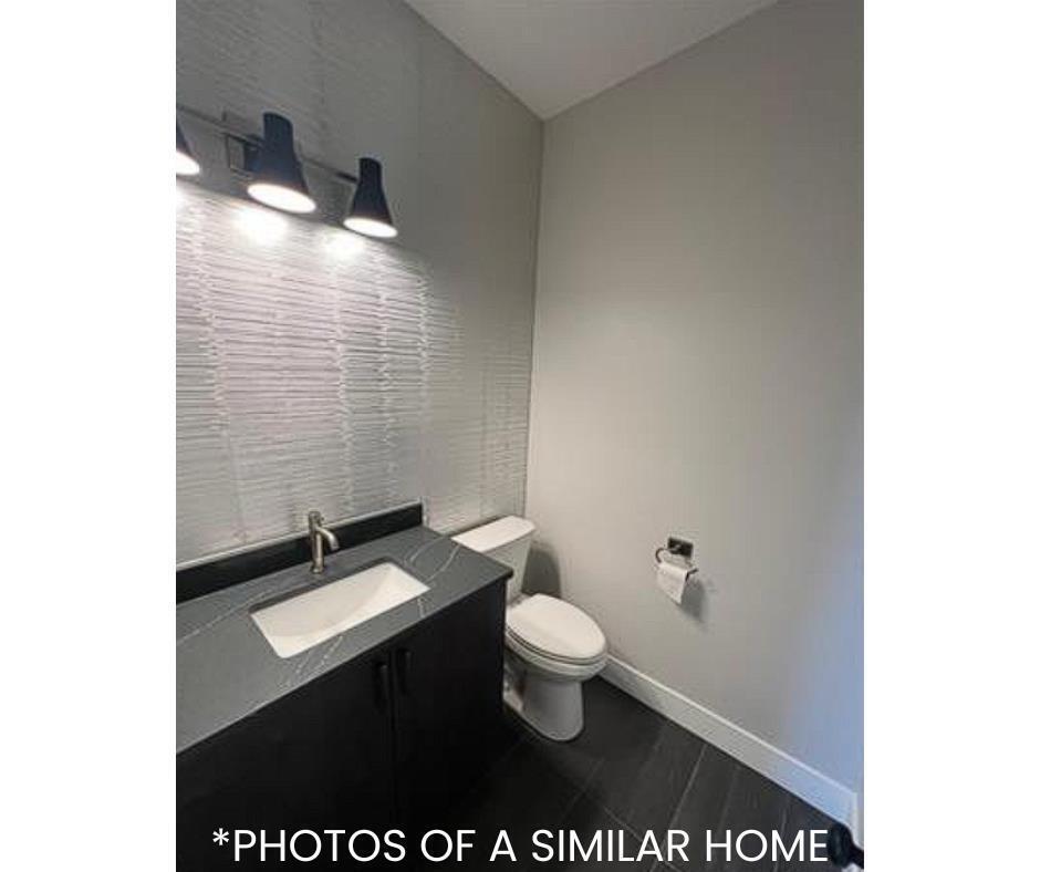 6414 Pelican Street Bettendorf, IA 52722 - Photo 36 of 57 a bathroom with a sink and a toilet