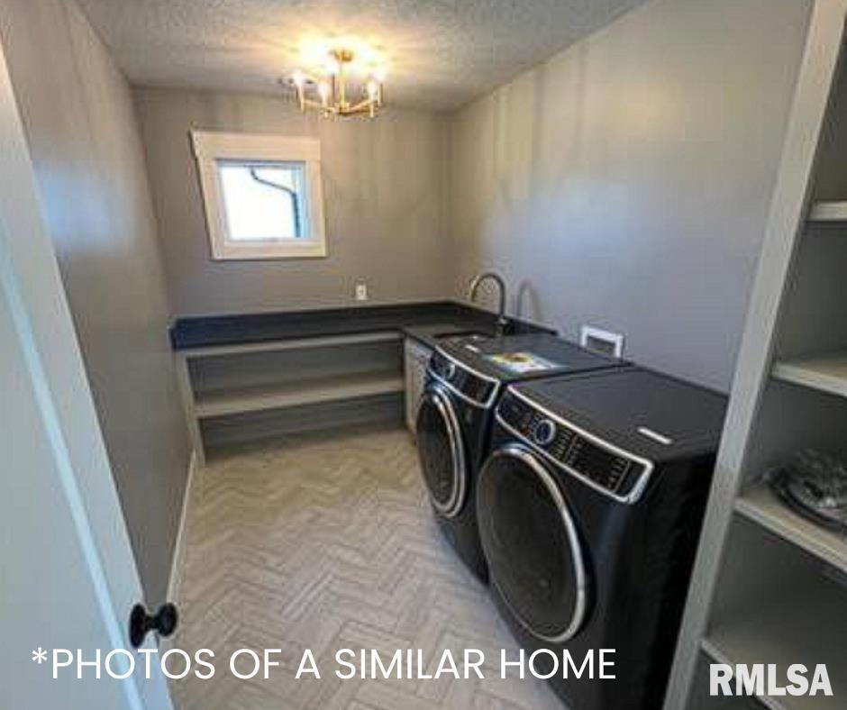 6414 Pelican Street Bettendorf, IA 52722 - Photo 37 of 57 a utility room with dryer and washer