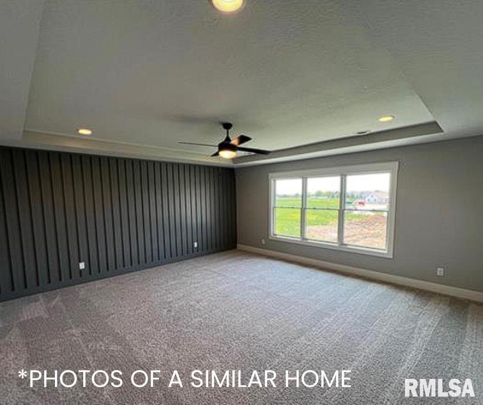 6414 Pelican Street Bettendorf, IA 52722 - Photo 38 of 57 an empty room with windows and ceiling fan