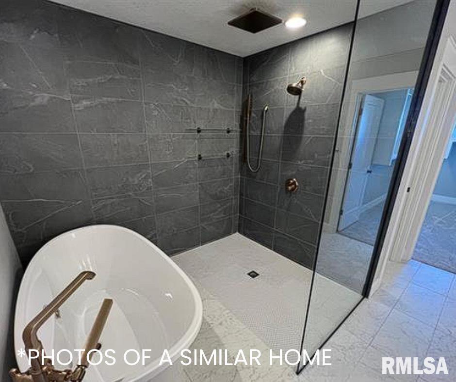 6414 Pelican Street Bettendorf, IA 52722 - Photo 42 of 57 a bathroom with a sink and shower