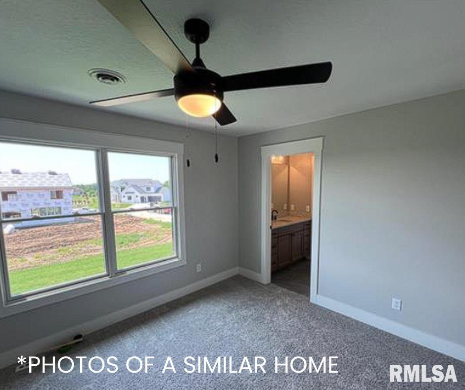 6414 Pelican Street Bettendorf, IA 52722 - Photo 45 of 57 a view of an empty room with a window