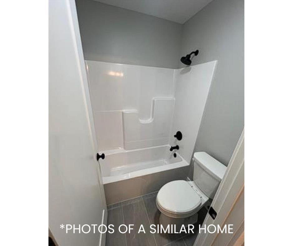 6414 Pelican Street Bettendorf, IA 52722 - Photo 47 of 57 a bathroom with a toilet and a shower