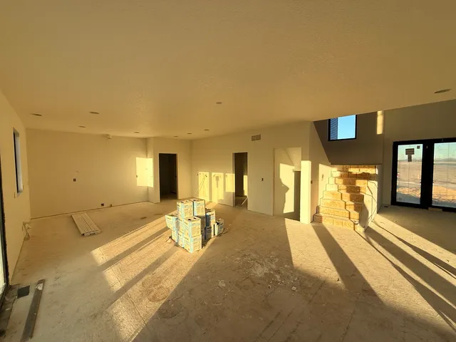 a view of a livingroom with furniture and windows