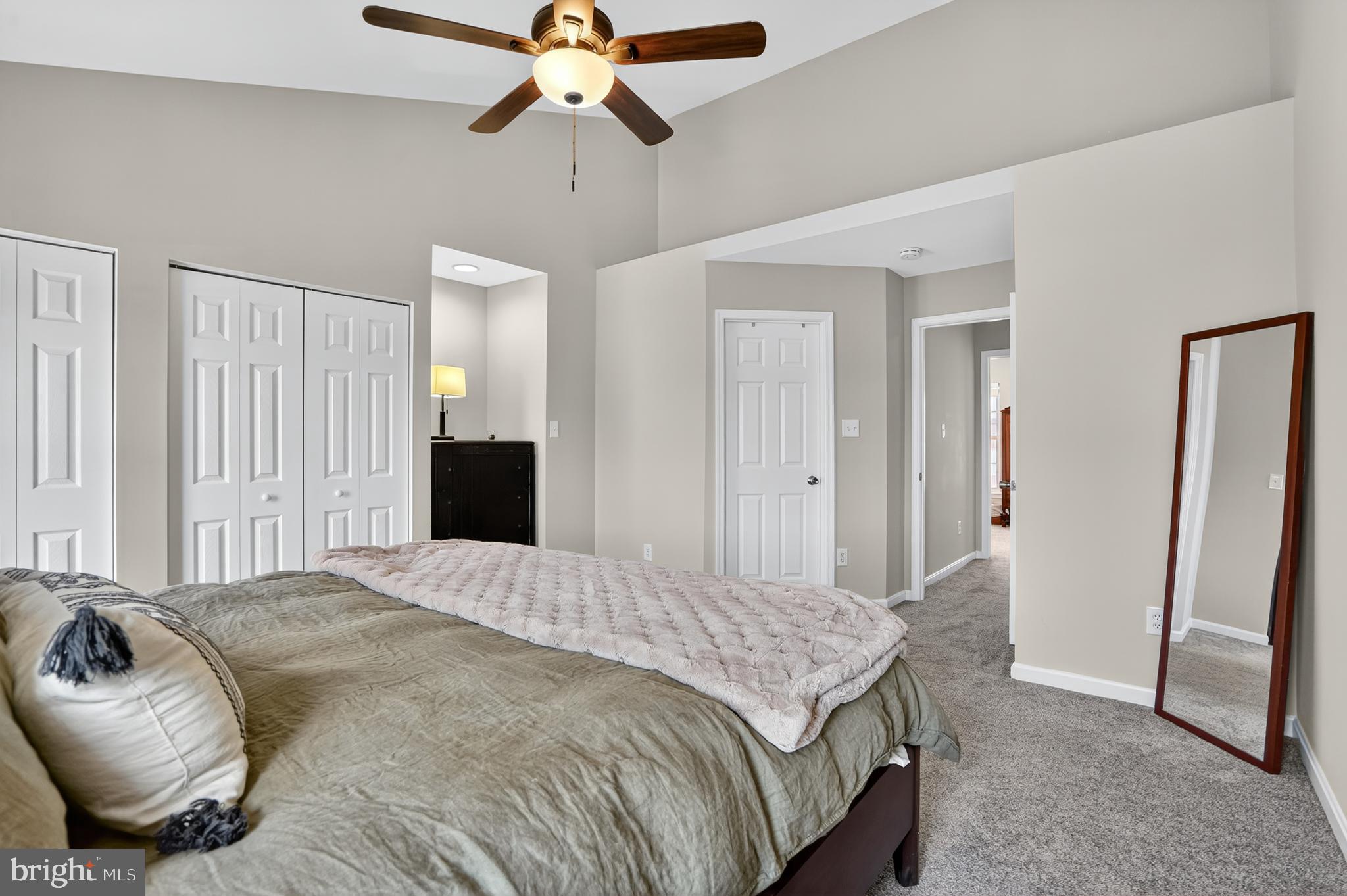 45445 Timber Trail Square Sterling, VA 20164 - Photo 14 of 38 a bedroom with a bed and a chandelier
