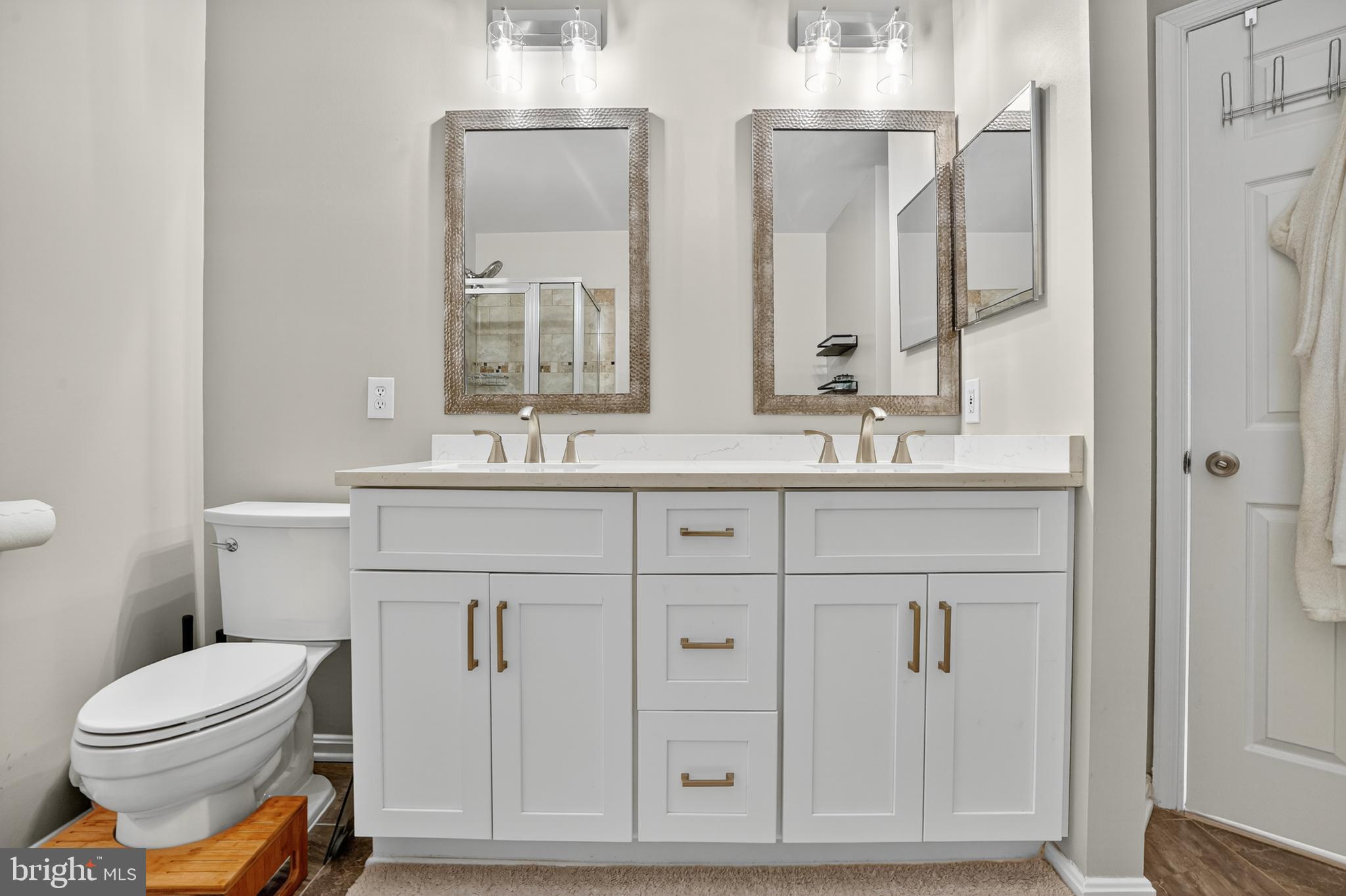 45445 Timber Trail Square Sterling, VA 20164 - Photo 15 of 38 a bathroom with a double vanity sink mirror and toilet
