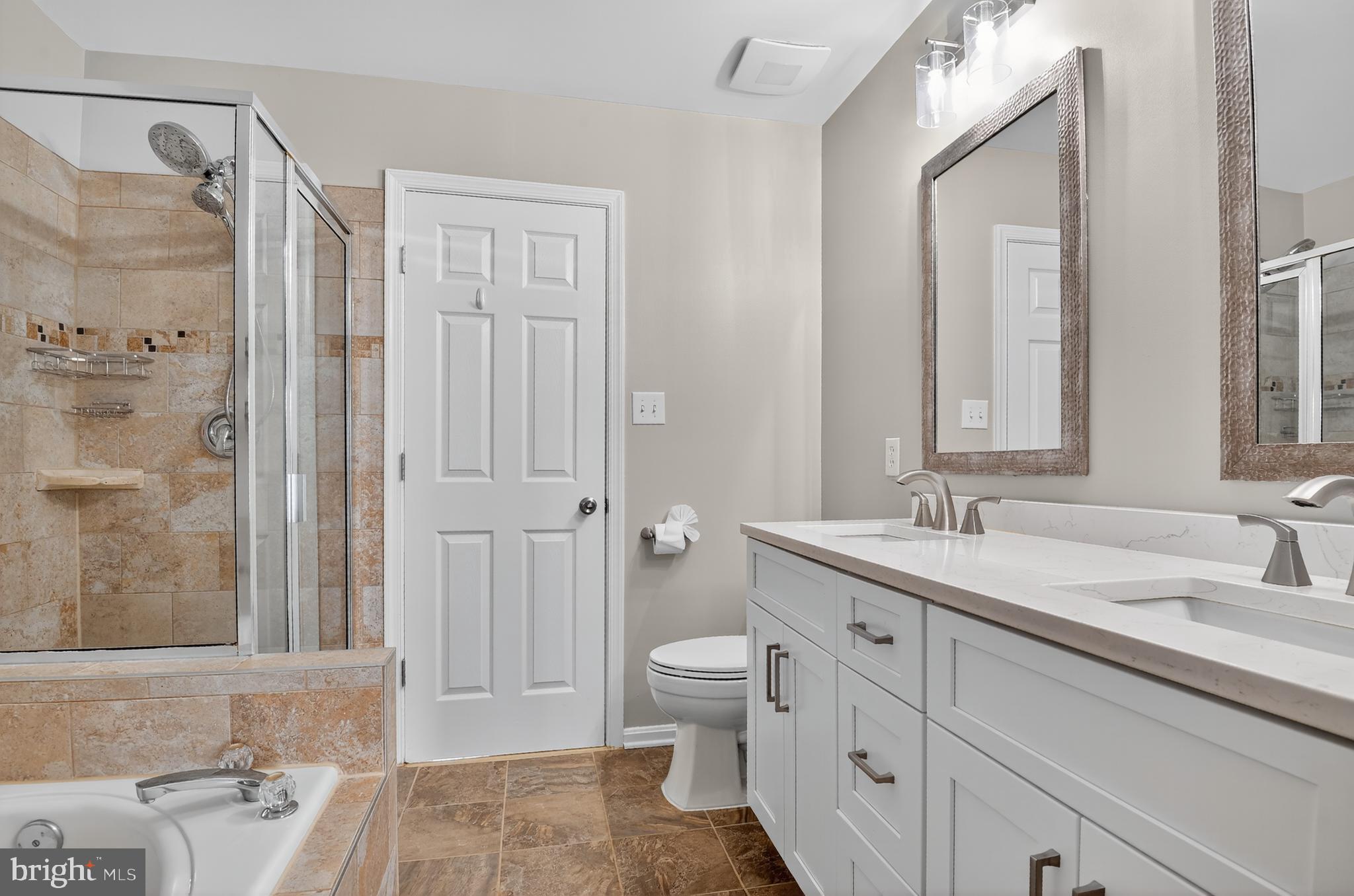 45445 Timber Trail Square Sterling, VA 20164 - Photo 16 of 38 a spacious bathroom with a double vanity sink toilet mirror and shower
