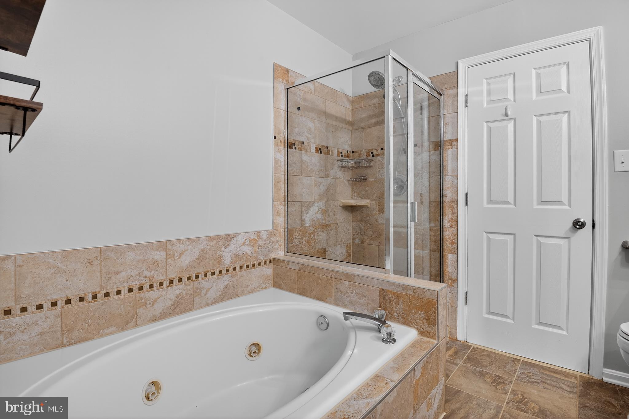 45445 Timber Trail Square Sterling, VA 20164 - Photo 17 of 38 a bathroom with a bathtub and a shower