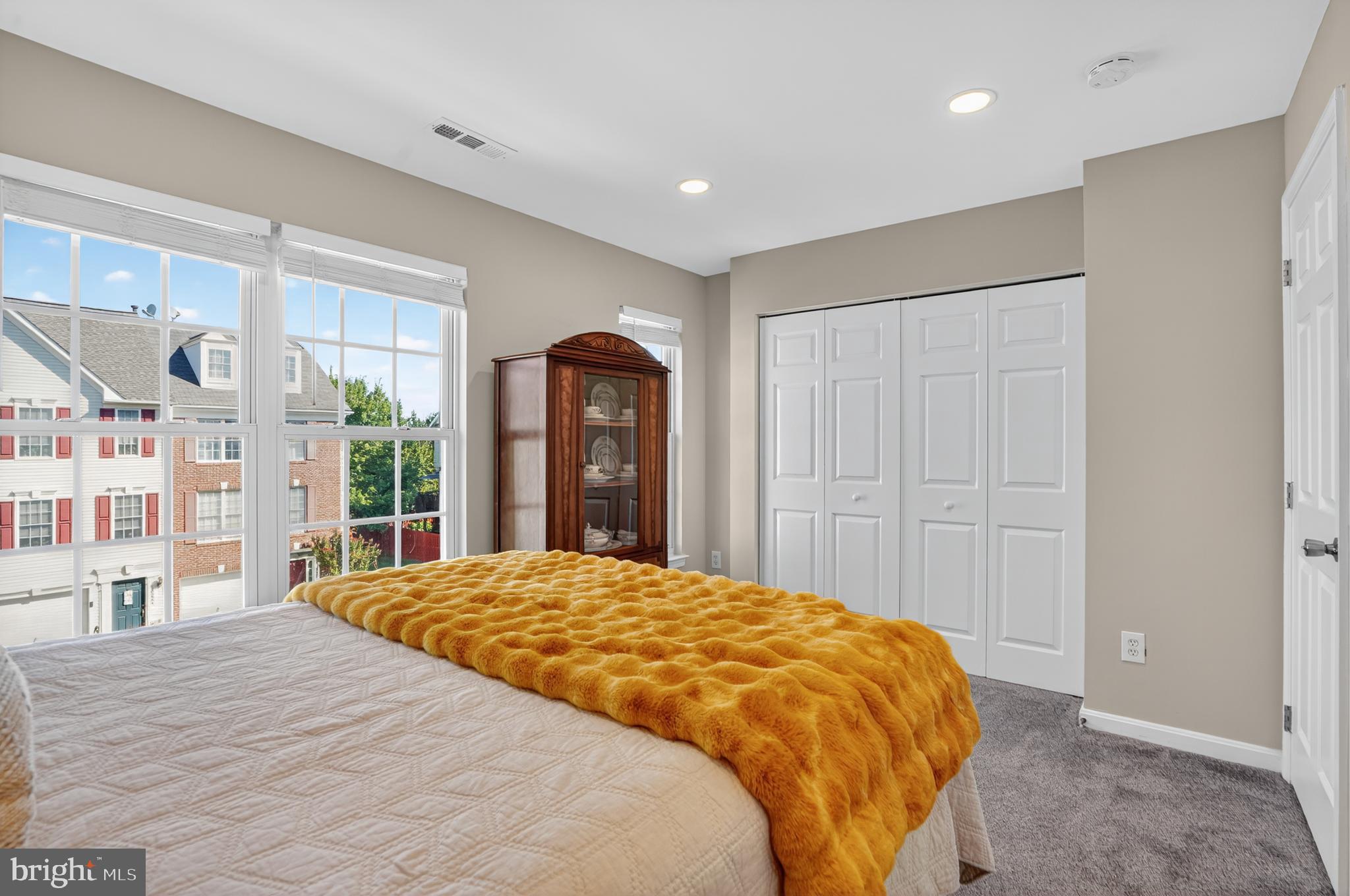 45445 Timber Trail Square Sterling, VA 20164 - Photo 19 of 38 a spacious bedroom with a large bed and a large window