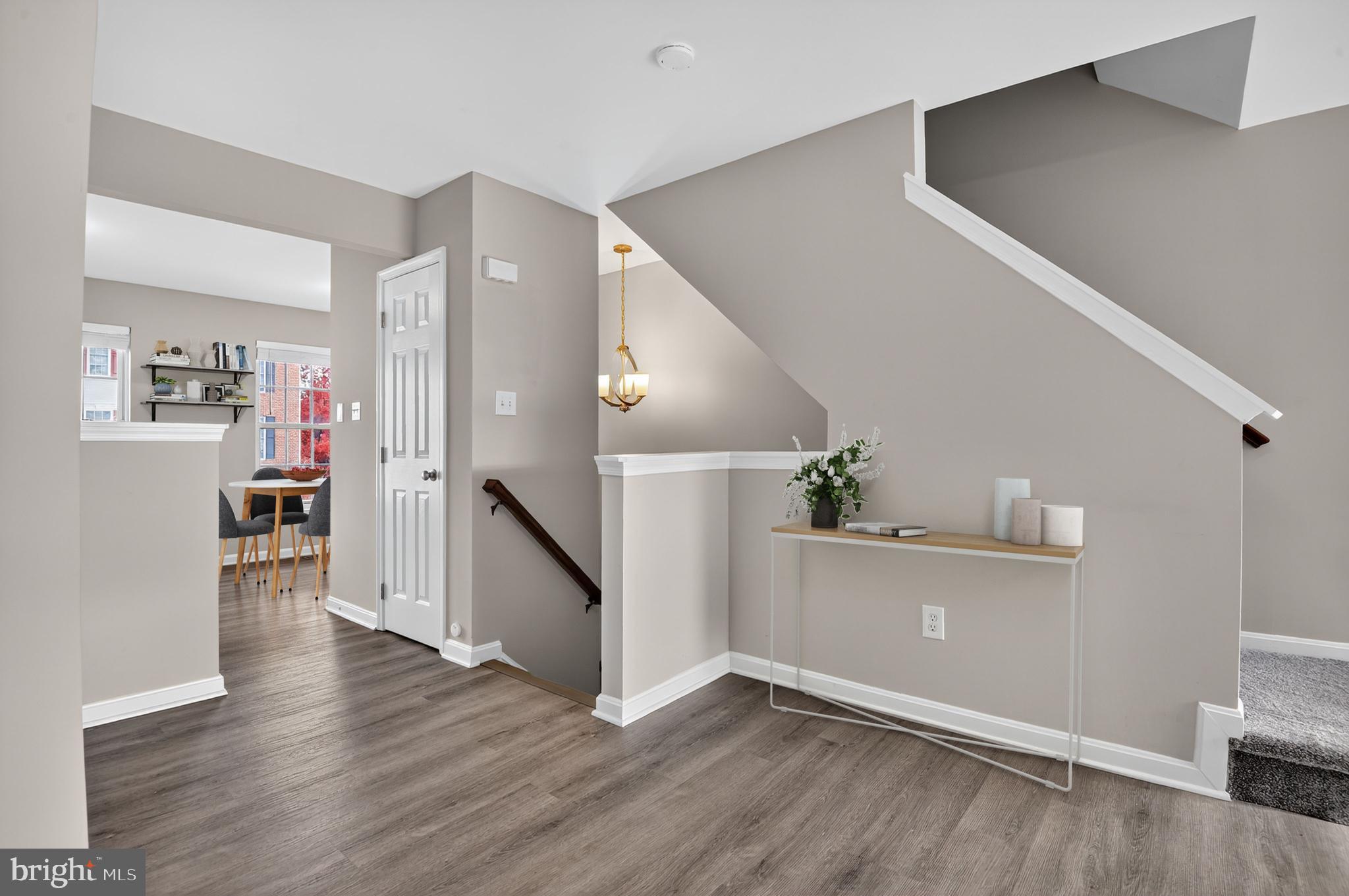 45445 Timber Trail Square Sterling, VA 20164 - Photo 5 of 38 a view of a livingroom with wooden floor and stairs