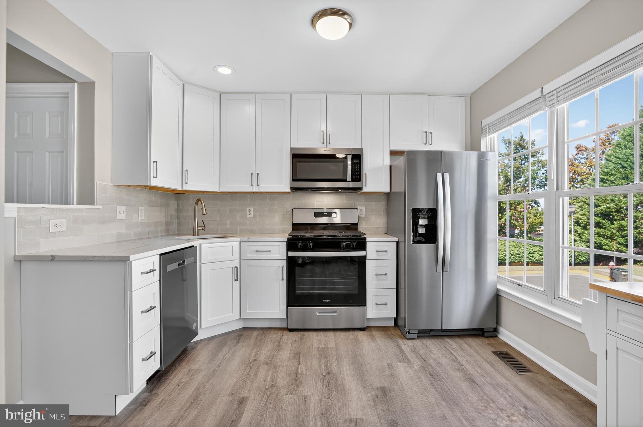 45445 Timber Trail Square Sterling, VA 20164 - Photo 7 of 38 a kitchen with a stove a refrigerator and a sink