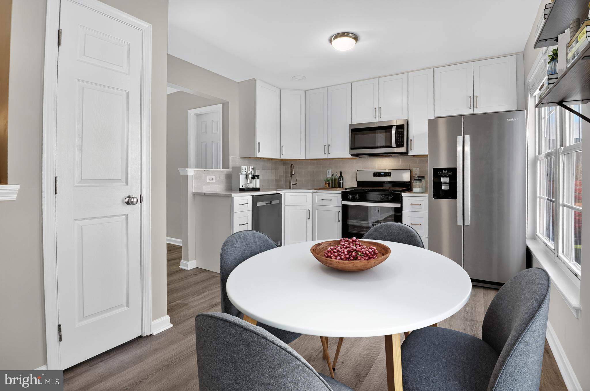 45445 Timber Trail Square Sterling, VA 20164 - Photo 9 of 38 a kitchen with stainless steel appliances granite countertop a dining table and chairs