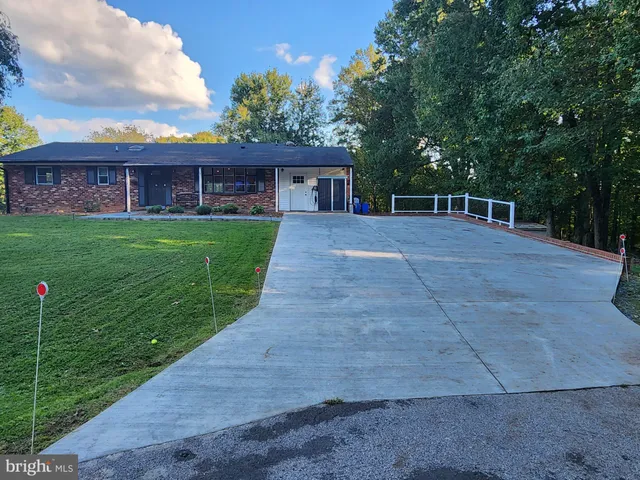 a view of house with backyard and entertaining space