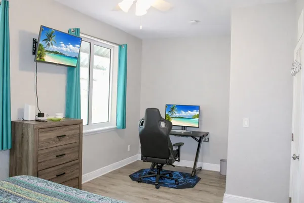 a bedroom with a bed and a dresser
