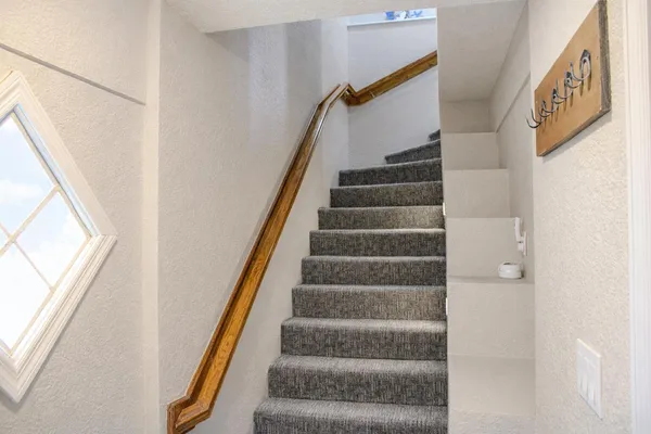 a view of walk in closet with clothes