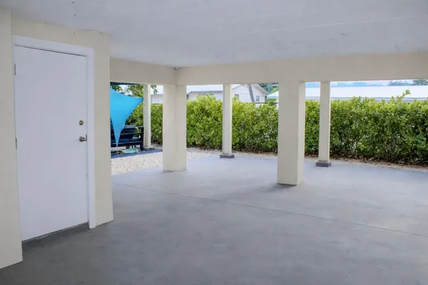 a view of a big room with windows and entryway