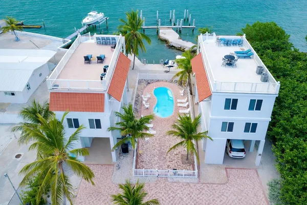 an aerial view of residential house with outdoor space