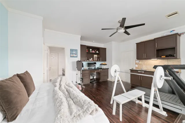 a bathroom with a granite countertop sink a toilet and a mirror