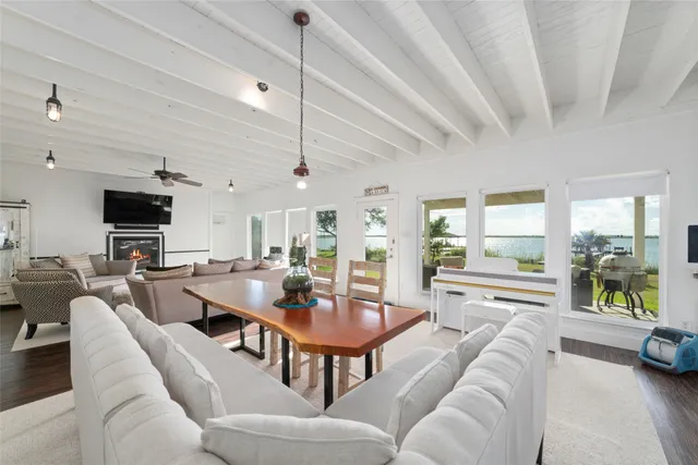 a kitchen with stainless steel appliances granite countertop a sink a stove and cabinets